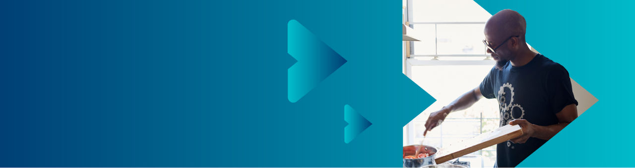 Person cooking in a kitchen.