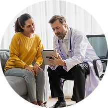 Doctor speaking with patient in consultation.