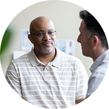 Patient speaking with doctor in consultation.